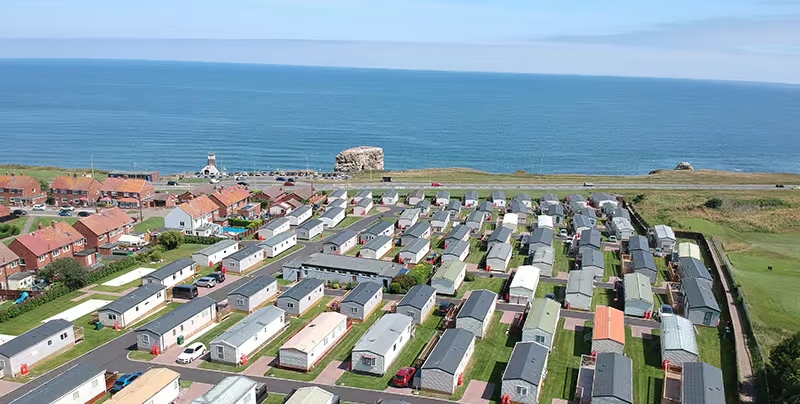birds eye view of caravans facing the sea